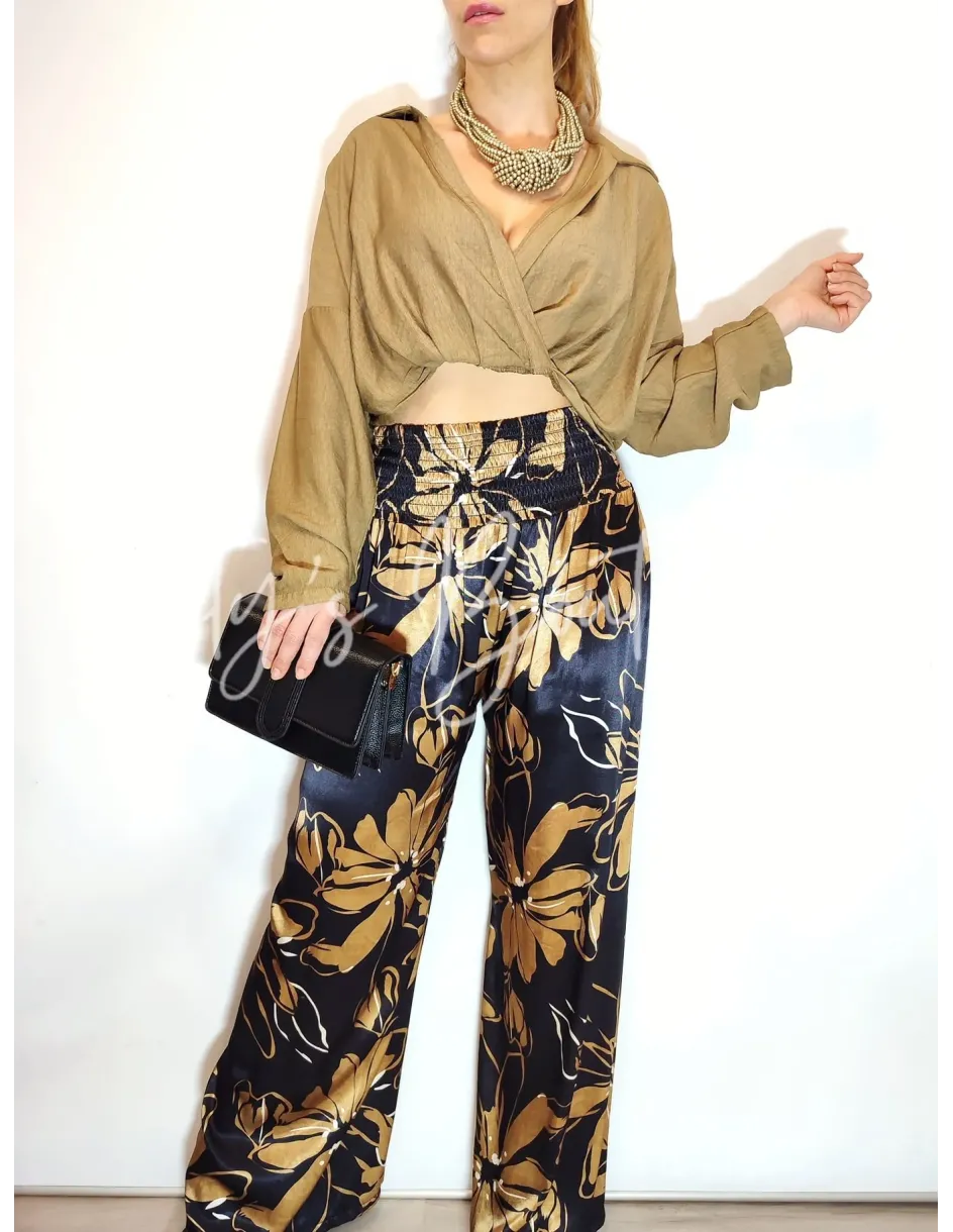Pantalón palazzo satinado azul noche con estampado floral dorado | Täty's Boutiques - Grupo Puerto Gragera